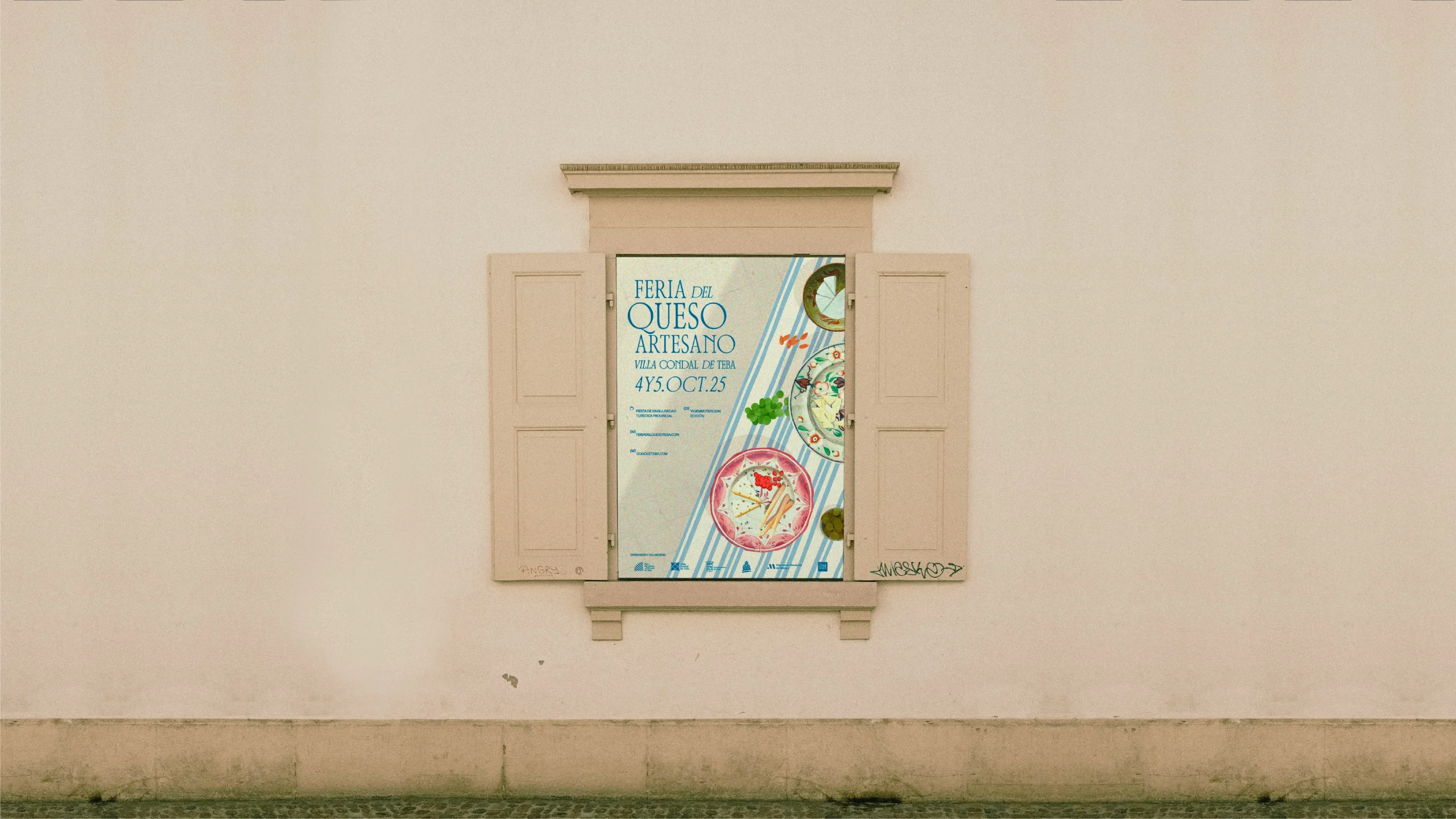 Diseño del cartel en una ventana para la Feria del Queso Artesano 2025 en Teba